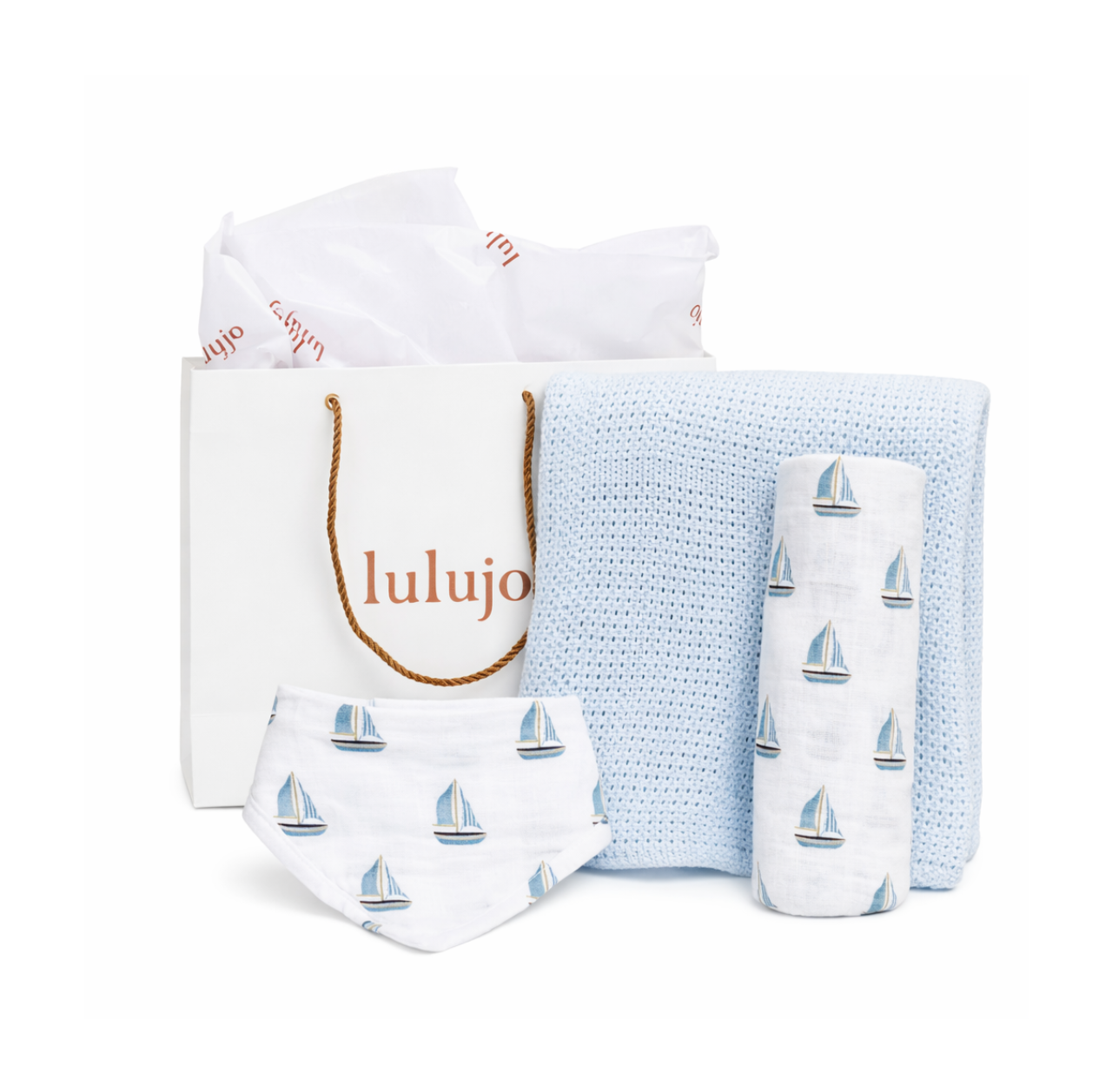 Baby product set with sailboat pattern including a bag, blanket, and bib o