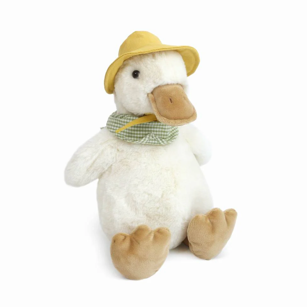 Plush duck toy wearing a hat and scarf on a white background