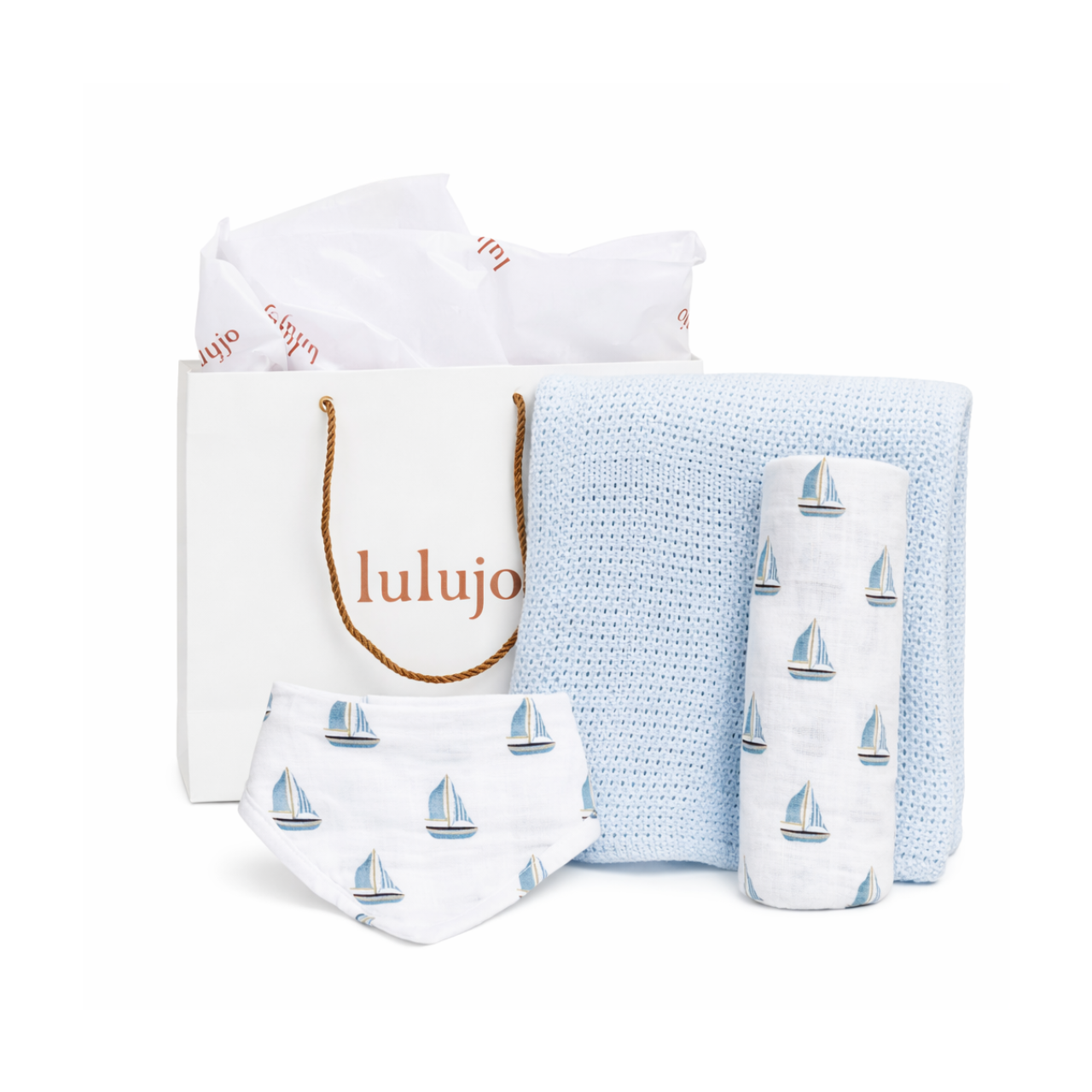 Baby product set with sailboat pattern including a bag, blanket, and bib o