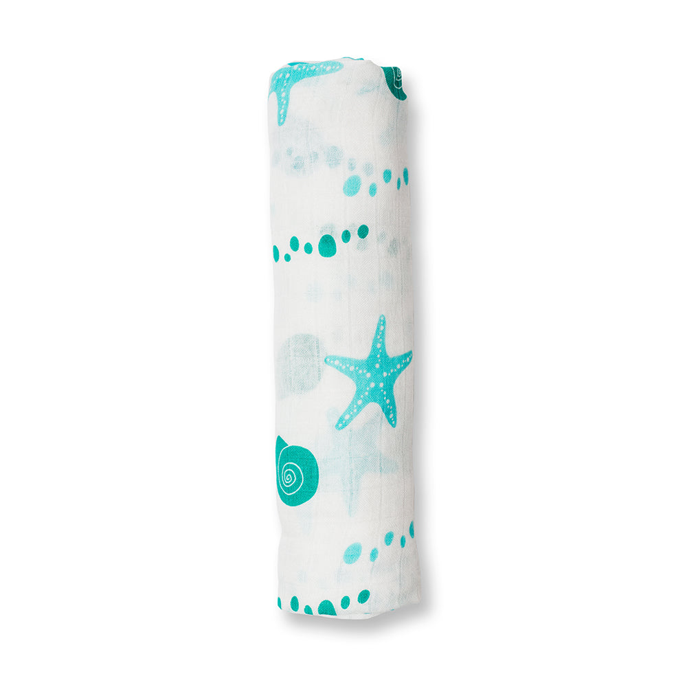 Rolled-up swaddle blanket with sea-themed design