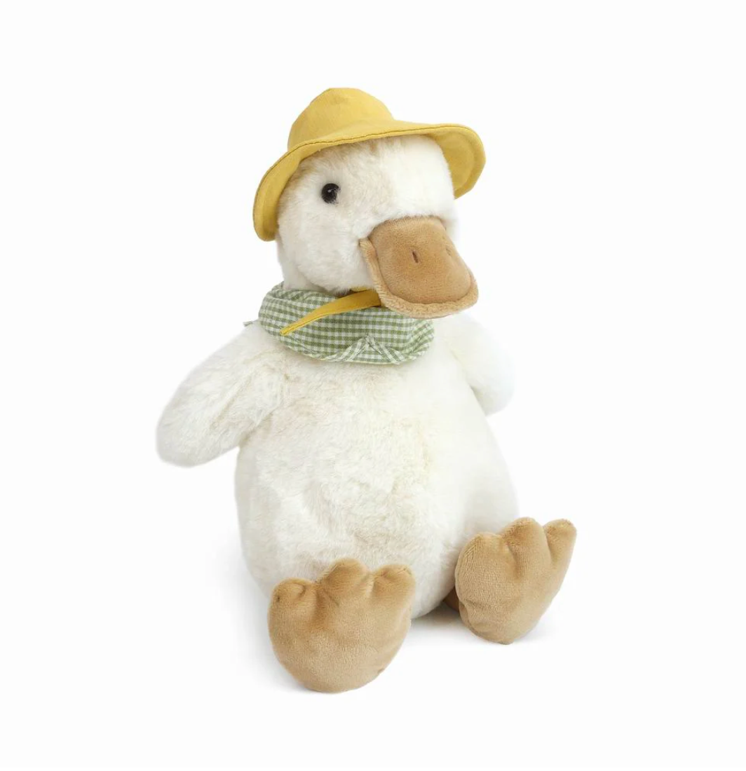 Plush duck toy wearing a hat and scarf on a white background